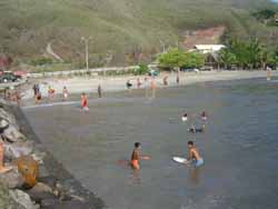 Boys on skim boards